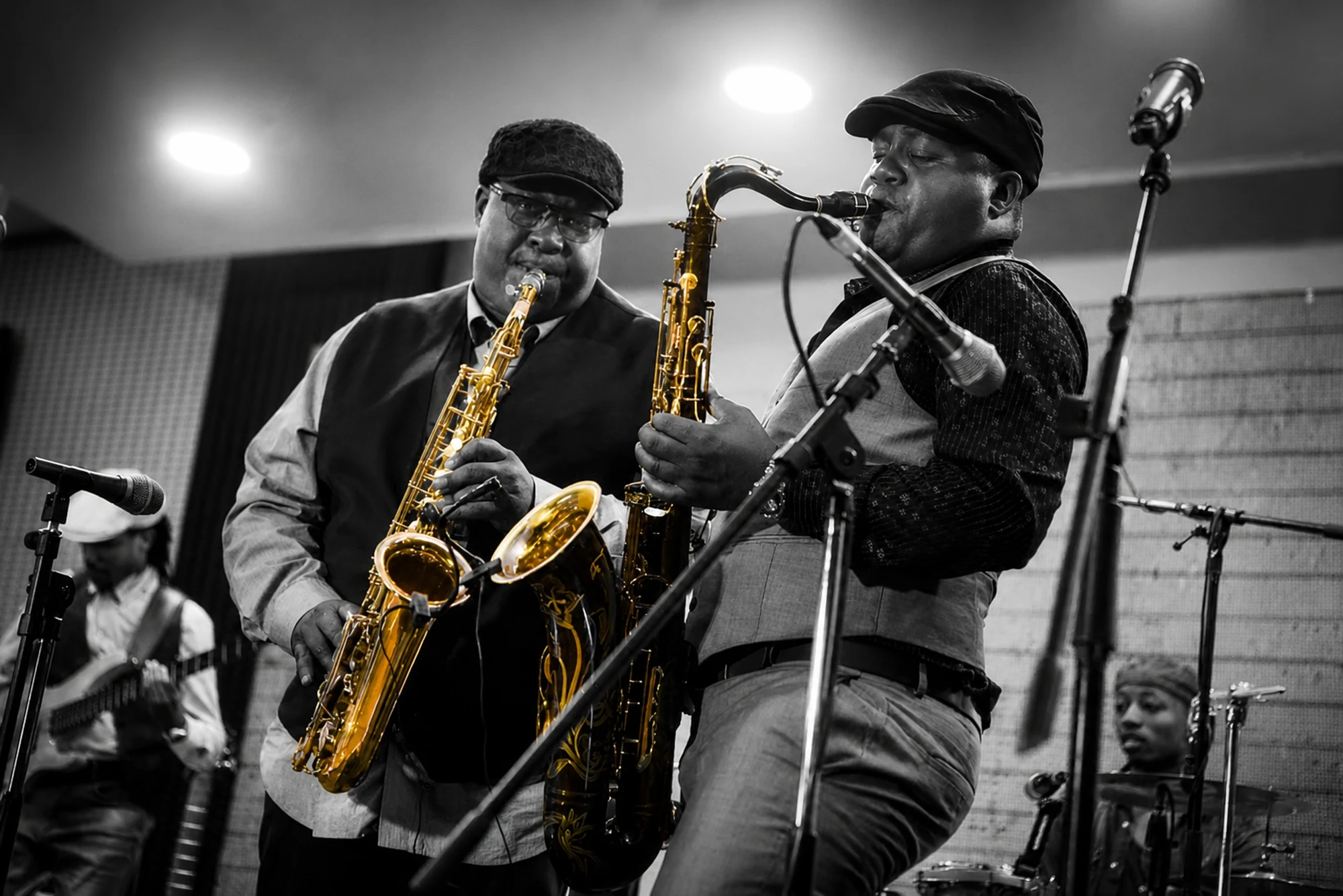 Two horn players from Different Faces Band performing together