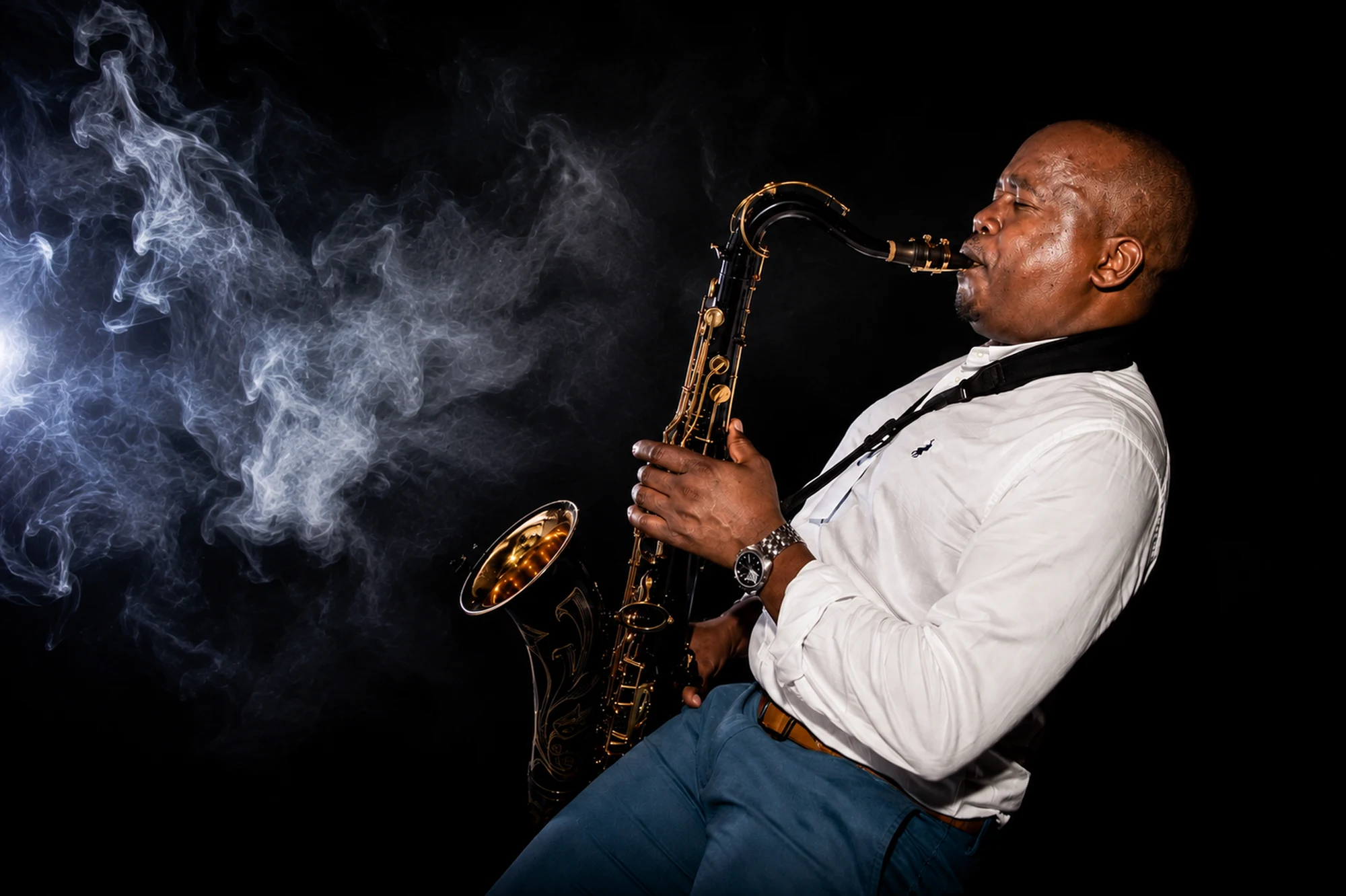 Edward Parseen leaning back into a phrase, smoke drifting across the frame